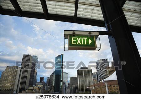Picture - Exit sign with view of buildings in downtown Sydney, Australia.. Fotosearch