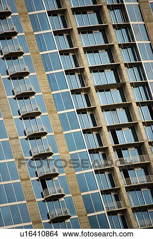 Exterior of high rise building with mirrored windows and balconies. View Large Photo Image Picture - Exterior of high rise building with mirrored windows and balconies.. Fotosearch