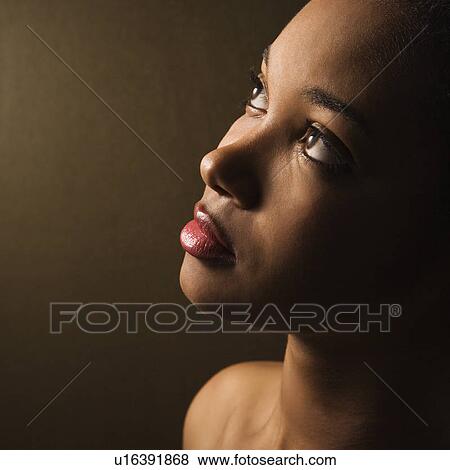 Female looking up View Large Photo Image Stock Photo - Female looking up. Fotosearch