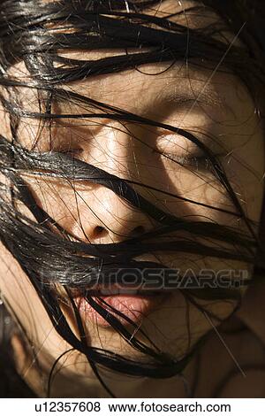 Stock Photo - Female's face with wet hair. Fotosearch