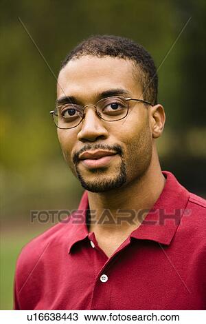 Stock Image - Head and shoulder portrait of adult man. Fotosearch
