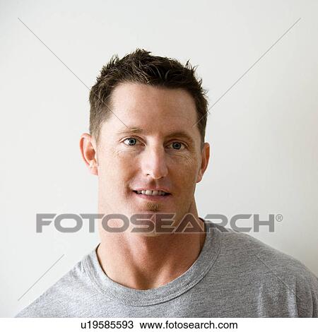 Head and shoulder portrait of man in t-shirt against white wall View Large Photo Image Stock Image - Head and shoulder portrait of man in t-shirt against white wall. Fotosearch