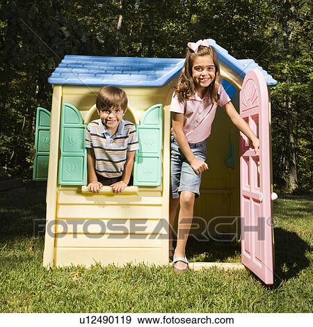 Hispanic boy and girl in outdoor playhouse smiling at viewer. View Large Photo Image Stock Photo - Hispanic boy and girl in outdoor playhouse smiling at viewer.. Fotosearch