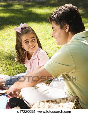 Hispanic father and daughter outsdoors smiling at each and relaxing on grass. View Large Photo Image Stock Photography - Hispanic father and daughter outsdoors smiling at each and relaxing on grass.. Fotosearch