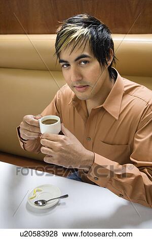 Hispanic mid adult man drinking expresso. View Large Photo Image Stock Photo - Hispanic mid adult man drinking expresso.. Fotosearch