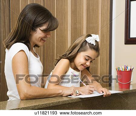Hispanic mother helping daughter with homework. View Large Photo Image Stock Image - Hispanic mother helping daughter with homework.. Fotosearch