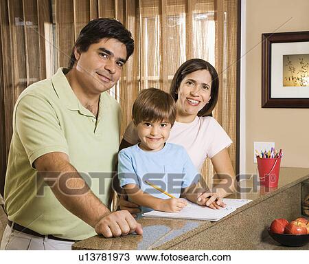 Hispanic parents and son with homework smiling at viewer. View Large Photo Image Stock Image - Hispanic parents and son with homework smiling at viewer.. Fotosearch