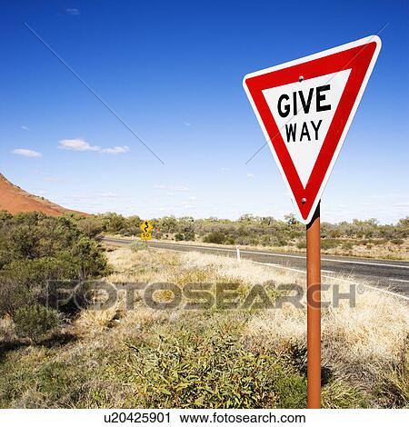 Stock Image - Humorous road sign reading Give Way in rural Australia.. Fotosearch