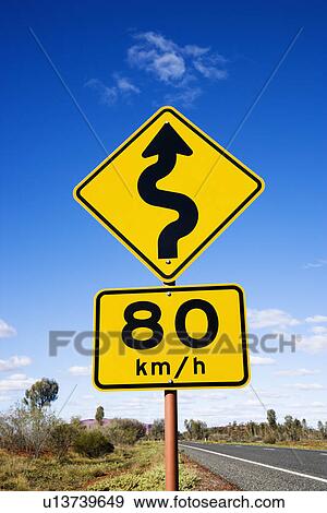Kilometer per hour speed limit and curve ahead road signs in rural Australia. View Large Photo Image Stock Photo - Kilometer per hour speed limit and curve ahead road signs in rural Australia.. Fotosearch