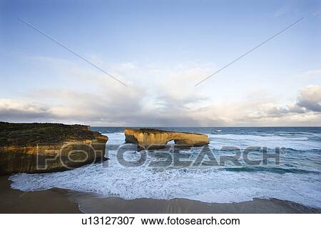London Arch formation on coastline of Great Ocean Road, Australia. View Large Photo Image Stock Photo - London Arch formation on coastline of Great Ocean Road, Australia.. Fotosearch