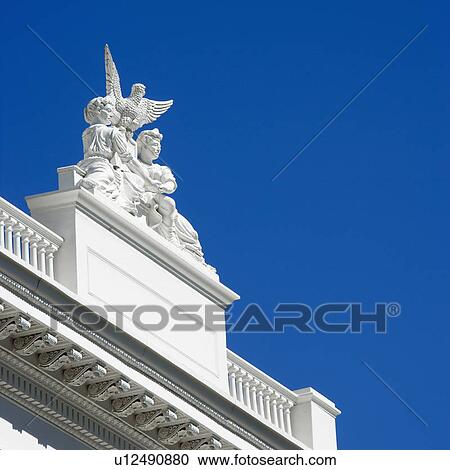 Stock Image - Low angle of statuary on the Sacramento Capitol building, California, USA. Fotosearch