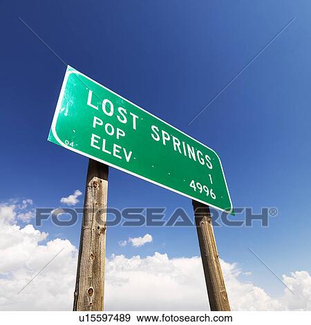 Stock Photo - Low angle view of population and elevation sign for Lost Springs, Wyoming.. Fotosearch