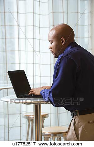 Male typing on laptop in computer View Large Photo Image Stock Photo - Male typing on laptop in computer. Fotosearch