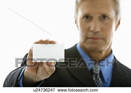 Man holding business card View Large Photo Image Stock Photo - Man holding business card . Fotosearch