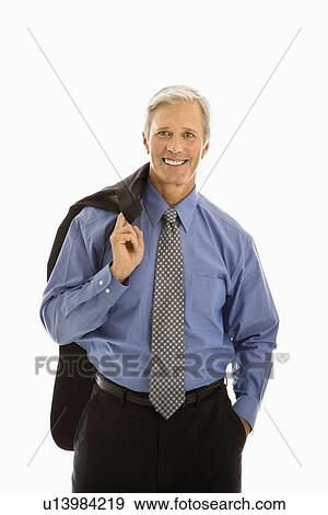 Man in business suit smiling at viewer with jacket draped over shoulder View Large Photo Image Stock Photo - Man in business suit smiling at viewer with jacket draped over shoulder. Fotosearch