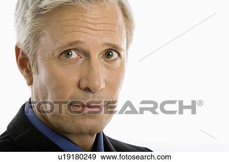 Stock Photo - Middle aged Caucasian businessman head shot.. Fotosearch