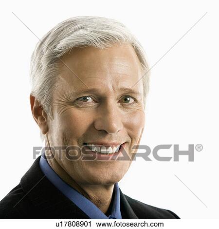 Stock Image - Middle aged Caucasian man in business suit smiling at viewer.. Fotosearch