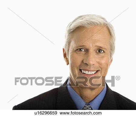 Stock Photo - Middle aged Caucasian man in business suit smiling at viewer.. Fotosearch