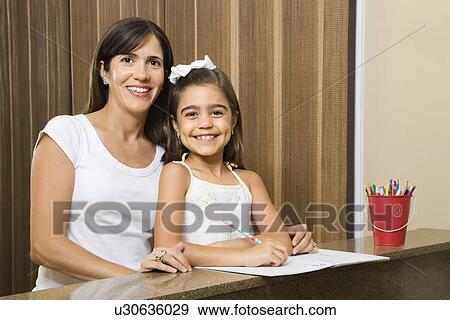 Mother and daughter portrait with homework View Large Photo Image Stock Photo - Mother and daughter portrait with homework. Fotosearch