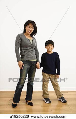 Mother and son holding hands View Large Photo Image Stock Photograph - Mother and son holding hands. Fotosearch