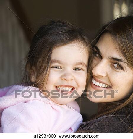 Mother holding daughter and smiling View Large Photo Image Stock Image - Mother holding daughter and smiling. Fotosearch