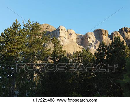 Mount Rushmore National Memorial seen through trees View Large Photo Image Stock Photo - Mount Rushmore National Memorial seen through trees. Fotosearch