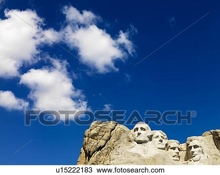 Mount Rushmore National Memorial with blue cloudy sky View Large Photo Image Stock Image - Mount Rushmore National Memorial with blue cloudy sky. Fotosearch
