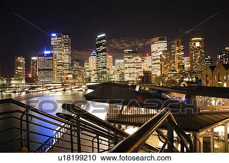 Night cityscape with buildings and harbor in Sydney, Australia. View Large Photo Image Stock Image - Night cityscape with buildings and harbor in Sydney, Australia.. Fotosearch