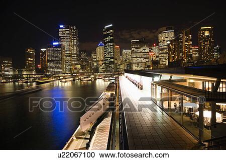Night skyline with buildings and harbor in Sydney, Australia. View Large Photo Image Stock Image - Night skyline with buildings and harbor in Sydney, Australia.. Fotosearch