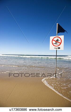 Stock Photograph - No surfing sign on beach in Surfers Paradise, Australia. Fotosearch