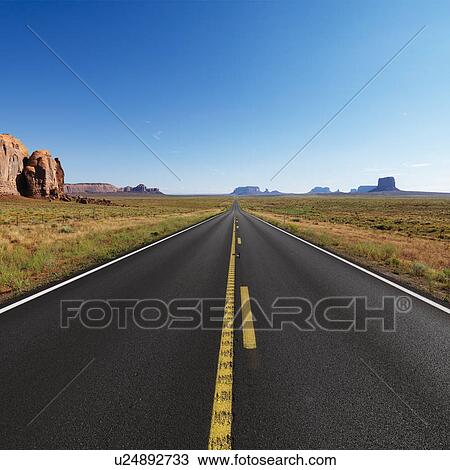 Open highway in scenic desert landscape with distant mountains and mesas View Large Photo Image Stock Image - Open highway in scenic desert landscape with distant mountains and mesas. Fotosearch