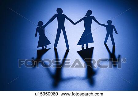 Stock Image - Paper cutout family of four standing holding hands.. Fotosearch