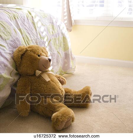 Plush brown teddy bear on bedroom floor. View Large Photo Image Stock Image - Plush brown teddy bear on bedroom floor.. Fotosearch