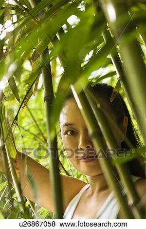 Portrait of Asian American woman in bamboo forest in Maui, Hawaii. View Large Photo Image Stock Photo - Portrait of Asian American woman in bamboo forest in Maui, Hawaii.. Fotosearch