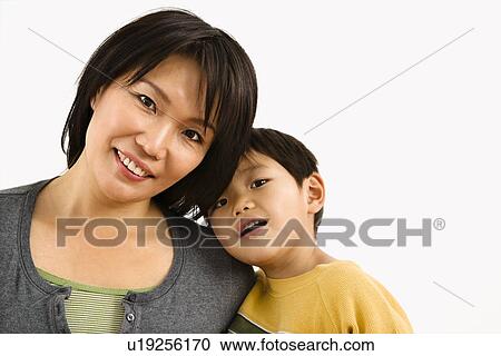 Portrait of Asian mother and young son leaning on eachother. View Large Photo Image Stock Image - Portrait of Asian mother and young son leaning on eachother.. Fotosearch
