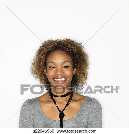 Portrait of pretty young woman smiling on white background. View Large Photo Image Stock Image - Portrait of pretty young woman smiling on white background.. Fotosearch