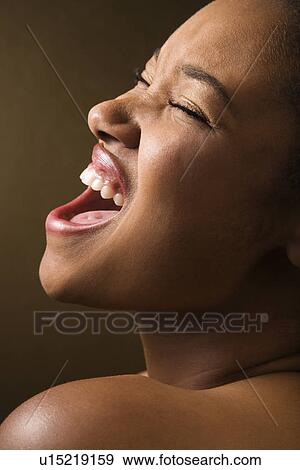 Portrait of smiling African-American young adult female singing. View Large Photo Image Stock Photo - Portrait of smiling African-American young adult female singing.. Fotosearch
