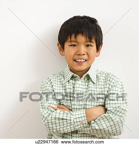 Stock Photograph - Portrait of young boy smiling. Fotosearch
