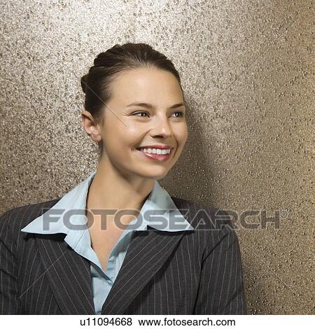 Stock Photo - Pretty businesswoman smiling. Fotosearch