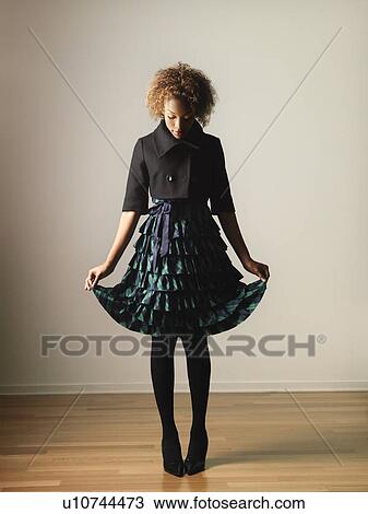 Stock Image - Pretty woman in dress portrait.. Fotosearch