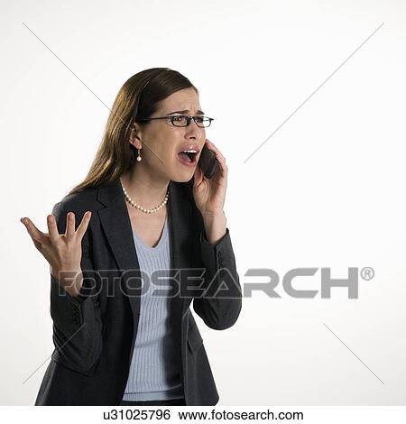 Professional business woman talking on cell phone with frustrated expression View Large Photo Image Stock Photograph - Professional business woman talking on cell phone with frustrated expression. Fotosearch