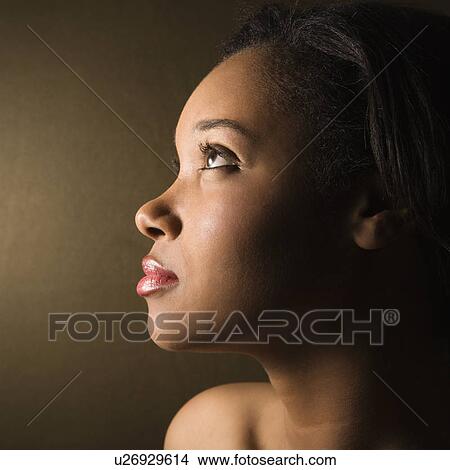 Picture - Profile of serious African-American young adult female.. Fotosearch