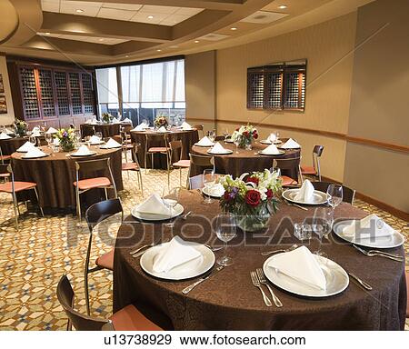 Restaurant interior with table setting and chairs View Large Photo Image Stock Photo - Restaurant interior with table setting and chairs. Fotosearch