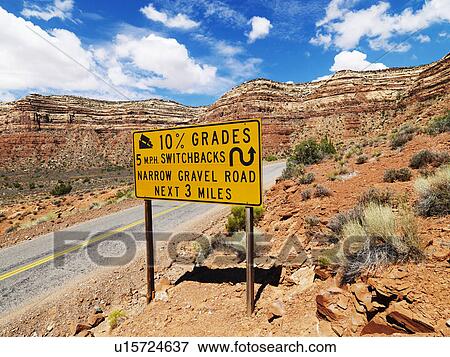 Stock Photo - Road sign warning steep grade in mountainous Utah landscape.. Fotosearch