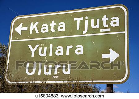Stock Image - Road sign with direction to Kata Tjuta and Yulara Uluru in Uluru Kata Tjuta National Park, Australia. Fotosearch