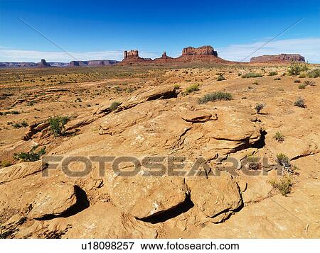 Stock Photo - Rocky desert landscape with landforms and mountains.. Fotosearch
