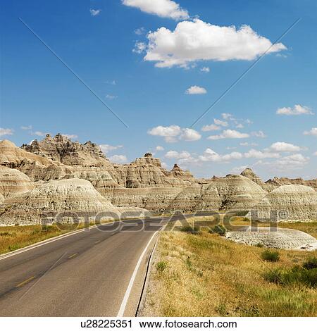 Stock Image - Scenic roadway in Badlands National Park, North Dakota. Fotosearch