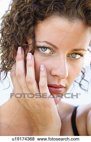 Stock Photo - Serious female looking at viewer. Fotosearch
