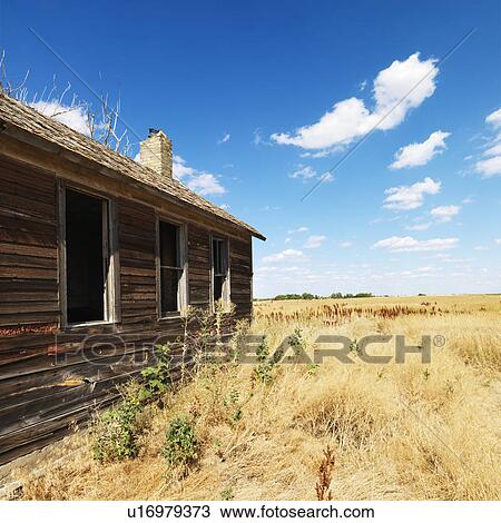 Side of wooden dilapidated building in rural field. View Large Photo Image Stock Image - Side of wooden dilapidated building in rural field.. Fotosearch