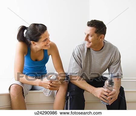 Sitting taking a break from a workout View Large Photo Image Stock Photograph - Sitting taking a break from a workout. Fotosearch